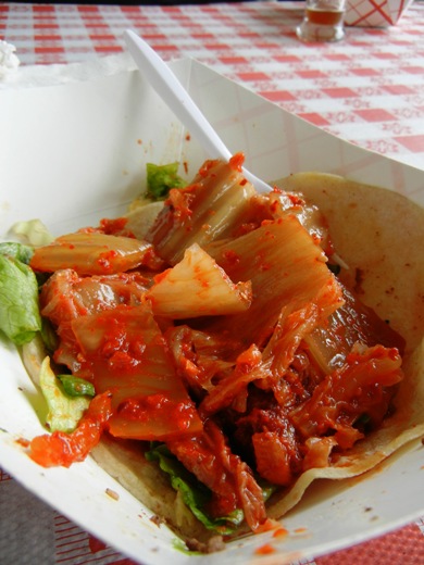 More kimchi. Looks like a kimchi taco.