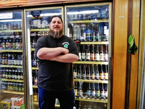 Jake in front of one of the craft beer coolers